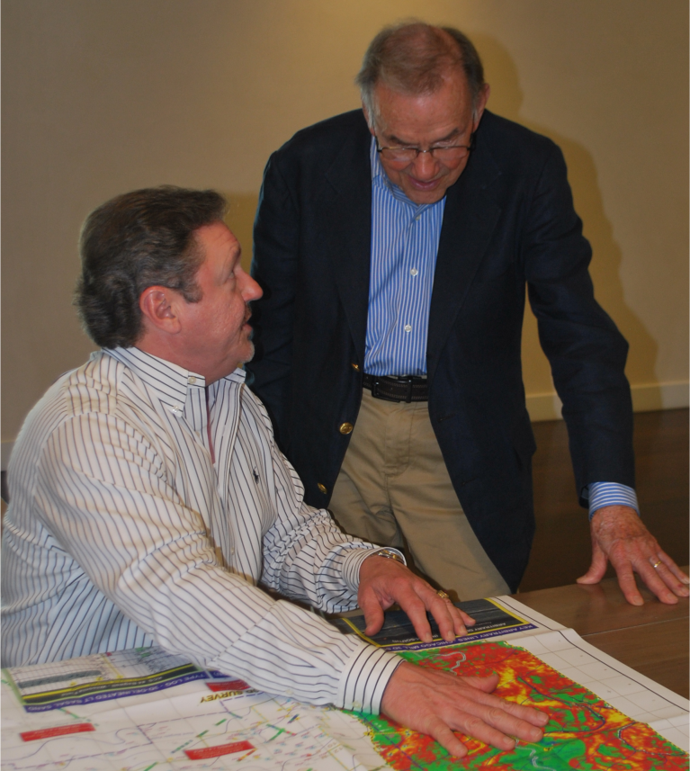 Image of people looking at a map of seismic data